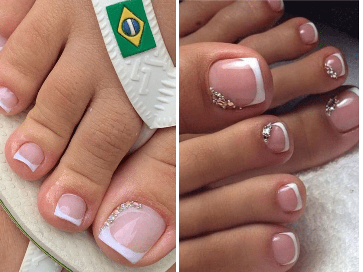 Unhas dos pés com esmalte francês e detalhes brilhantes em sandálias brancas.