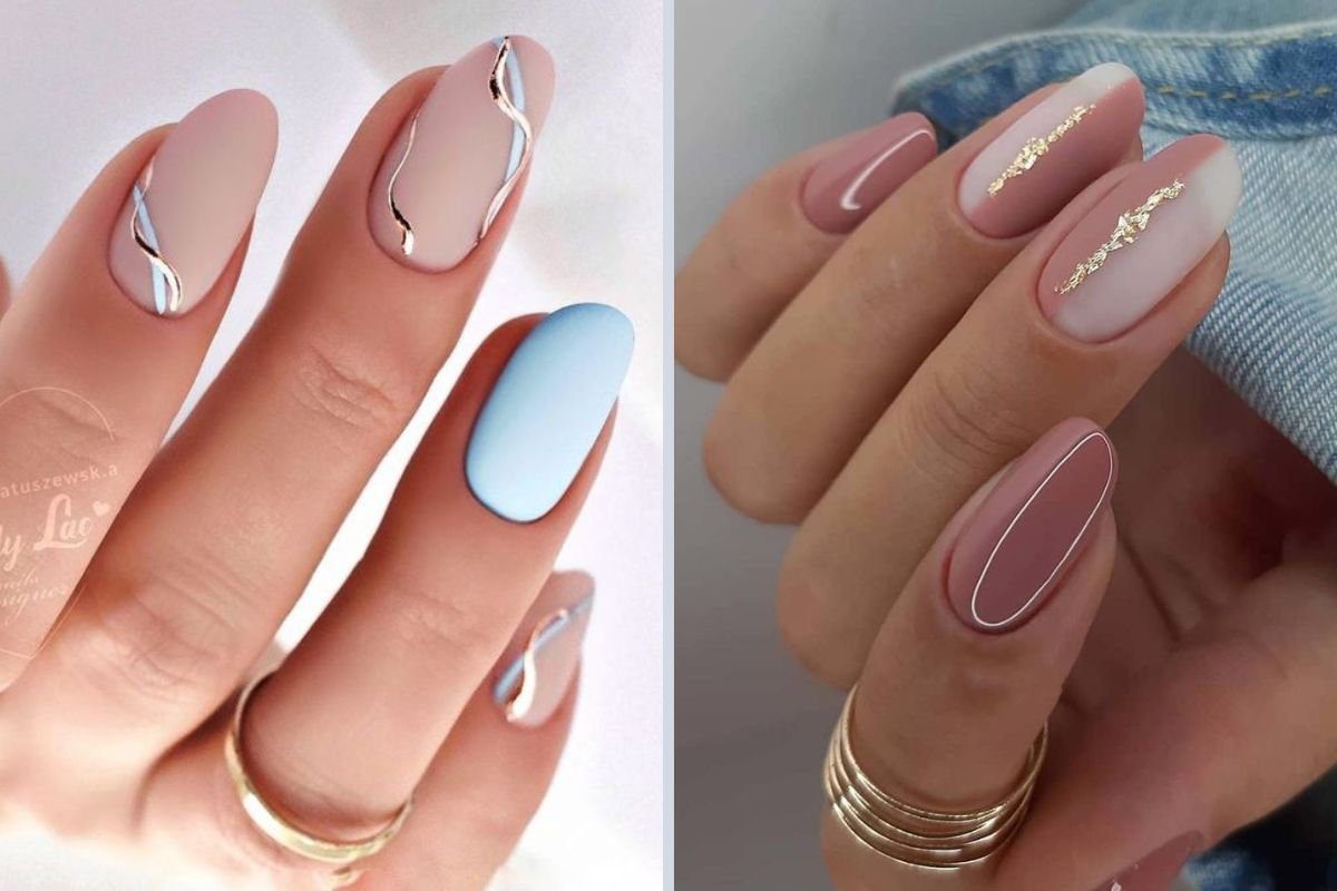 Unhas decoradas com esmalte nude, azul e detalhes metálicos em designs elegantes.
