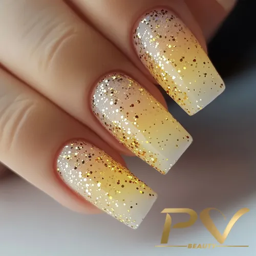 unhas-amarelas-gliter-decoradas-pv-beauty-16 Unhas decoradas com esmalte degradê dourado e glitter brilhante.
