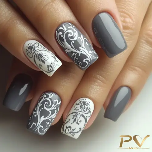 unhas-cinza-arabescos-decorados-lindos-pv-beauty-13 Unhas decoradas com esmalte cinza e branco, com detalhes artísticos florais em algumas delas.