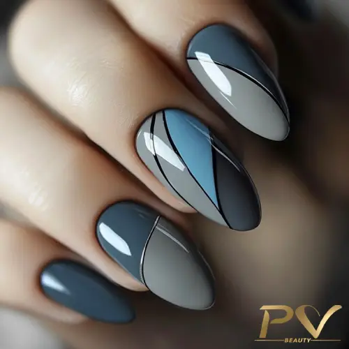 unhas-cinza-decoacao-curvas-mix-cores-pv-beauty-12 Unhas decoradas com esmalte em tons de azul e cinza, com design geométrico e linhas pretas.