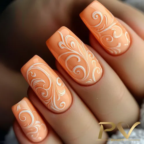 unhas-laranja-decoradas-arabescos-lindos-pv-beauty-32 Unhas decoradas com esmalte laranja e desenhos de arabescos brancos.
