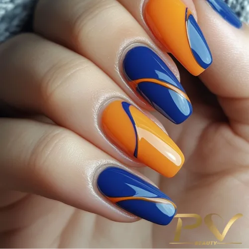 unhas-laranja-decoradas-azul-pv-beauty-30 Unhas com esmalte azul e laranja, decoradas com linhas curvas em design moderno e elegante.